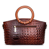 Valencia croc-embossed leather satchel with top handles and crossbody strap
