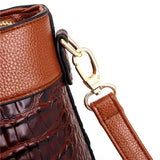 Valencia croc-embossed leather satchel with top handles and crossbody strap