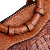 Valencia croc-embossed leather satchel with top handles and crossbody strap