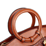 Valencia croc-embossed leather satchel with top handles and crossbody strap