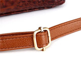 Valencia croc-embossed leather satchel with top handles and crossbody strap