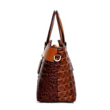 Valencia croc-embossed leather satchel with top handles and crossbody strap