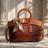 Valencia croc-embossed leather satchel with top handles and crossbody strap
