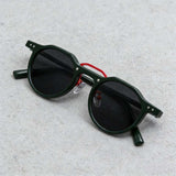 Transparent acetate sunglasses with multicolor patterned temples