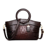 Valencia croc-embossed leather satchel with top handles and crossbody strap