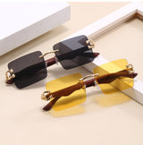 Rimless gradient sunglasses with gold feline temple detail