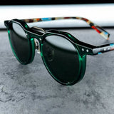 Transparent acetate sunglasses with multicolor patterned temples