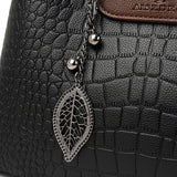 Valleria croc-embossed leather satchel with braided handle