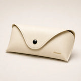 Slim vegan leather eyewear case with soft lining and snap closure
