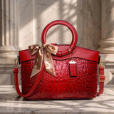 Valencia croc-embossed leather satchel with top handles and crossbody strap